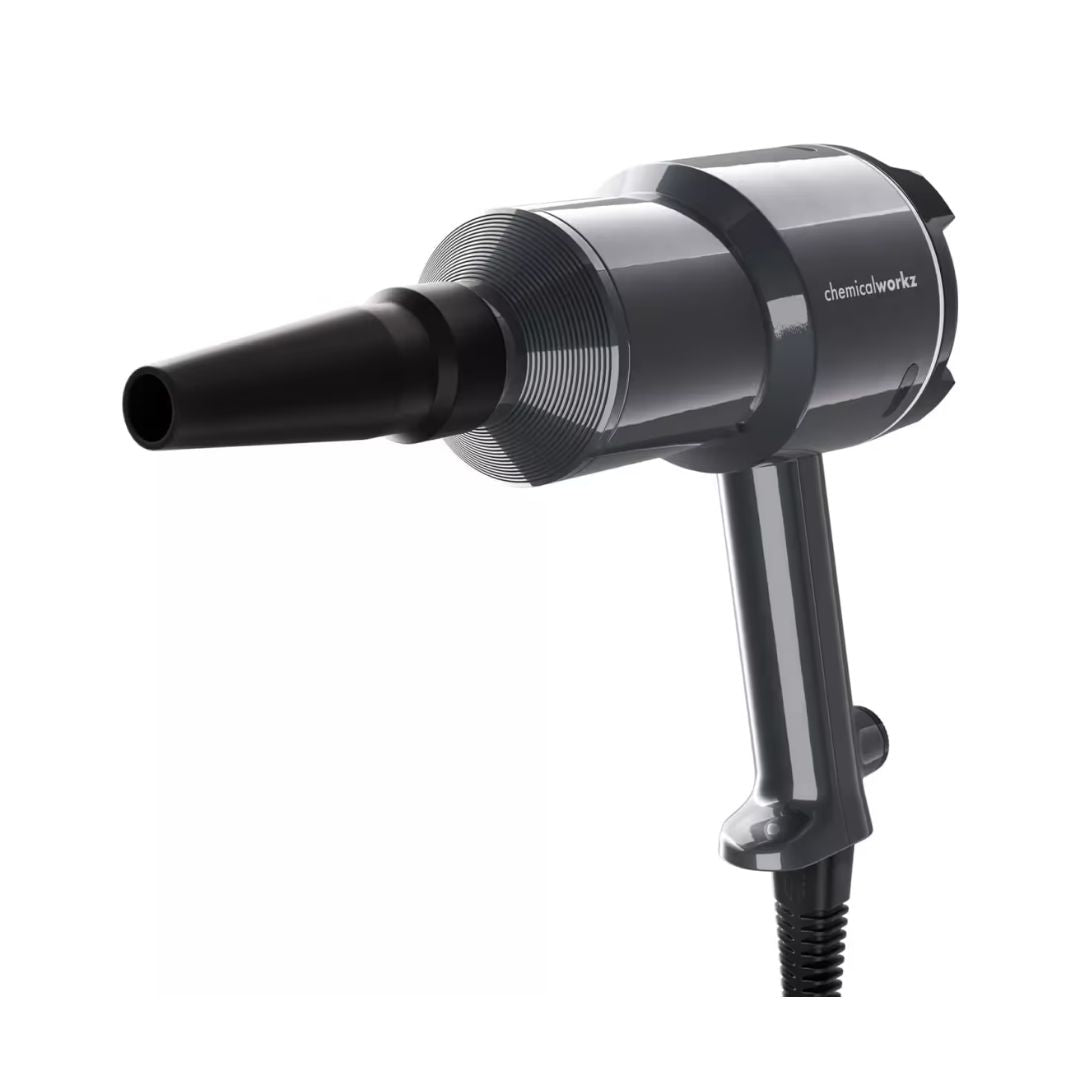 Black car dryer with nozzle attachment on a white background