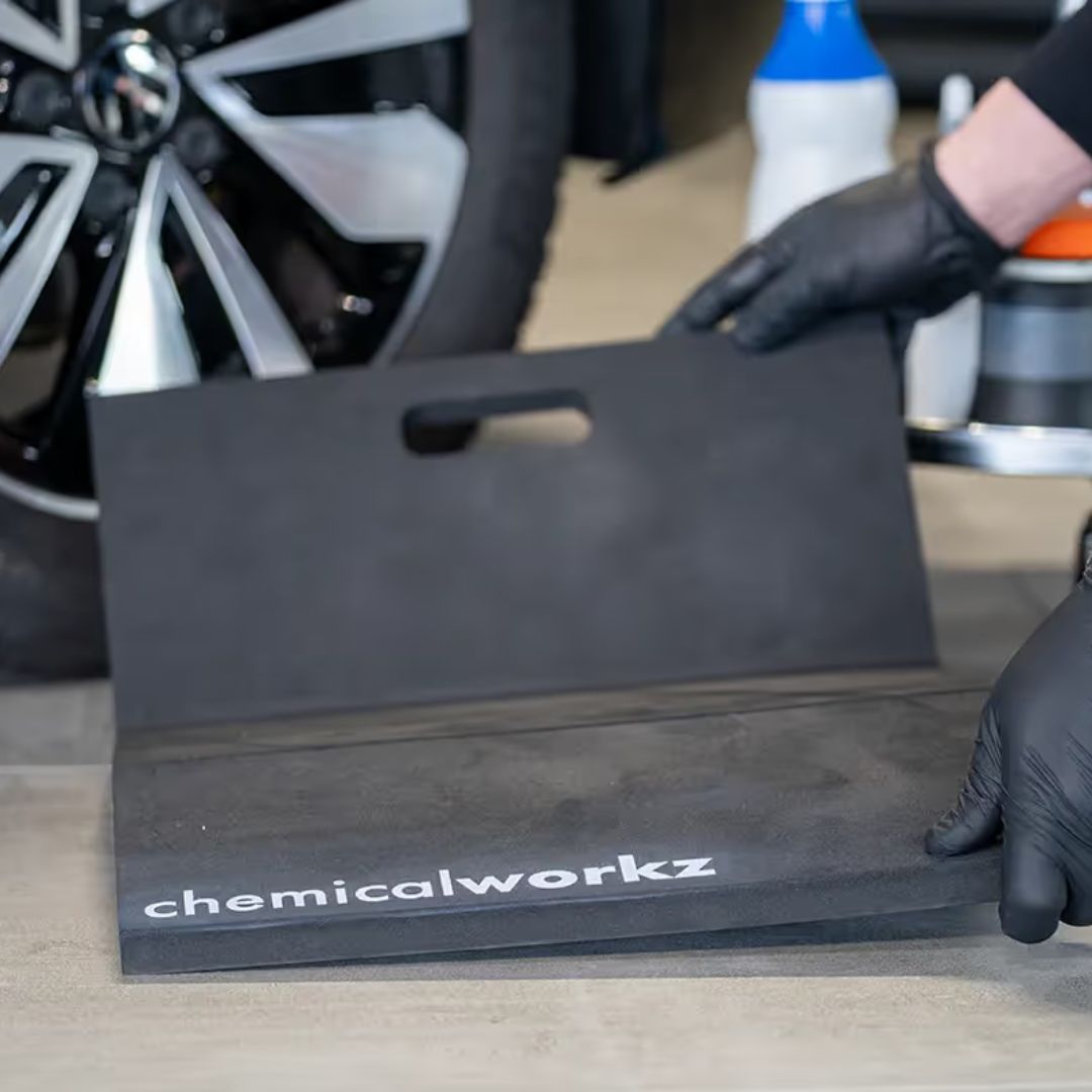 Black car detailing mat with 'chemicalworkz' branding on a car floor.