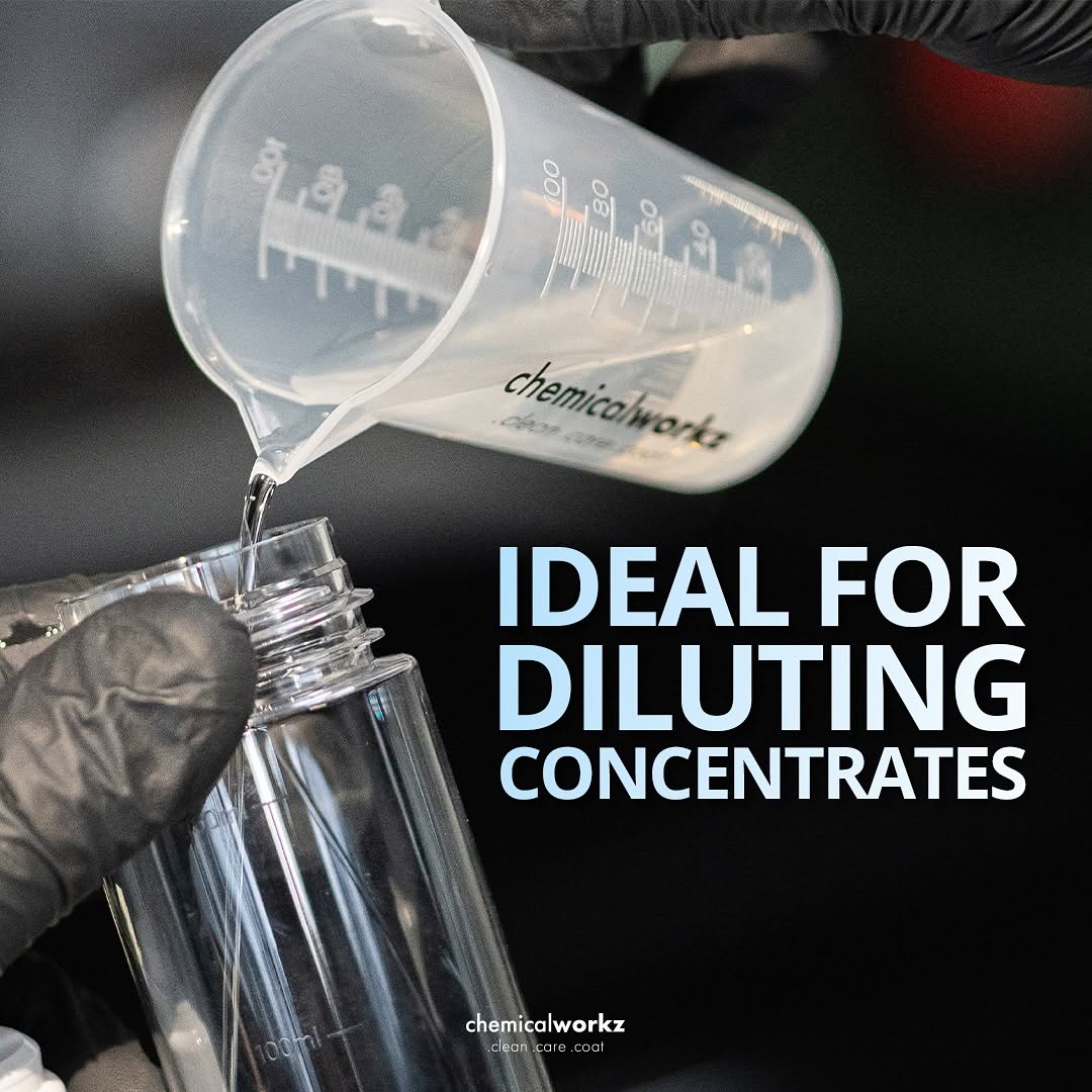 Person pouring liquid from a measuring cup into a bottle with 'chemicalworkz' branding, text 'IDEAL FOR DILUTING CONCENTRATES' displayed.