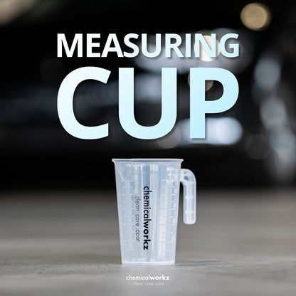 Clear measuring cup with 'chemicalworkz' branding on a blurred background