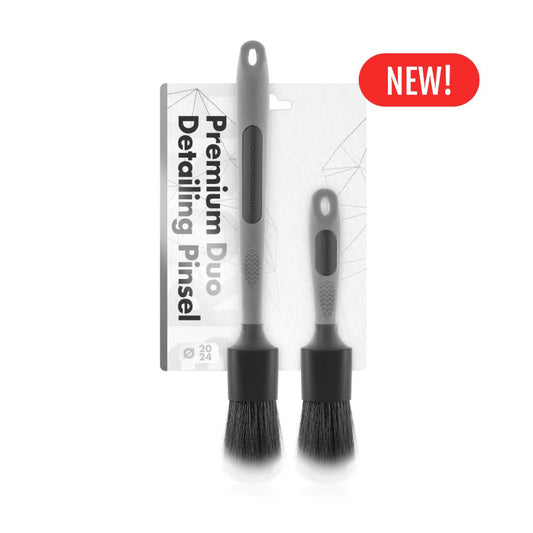Two chemicalworkz ultra soft detailing brushes with Grey handles and black bristles, accompanied by their packaging on a white background with new label