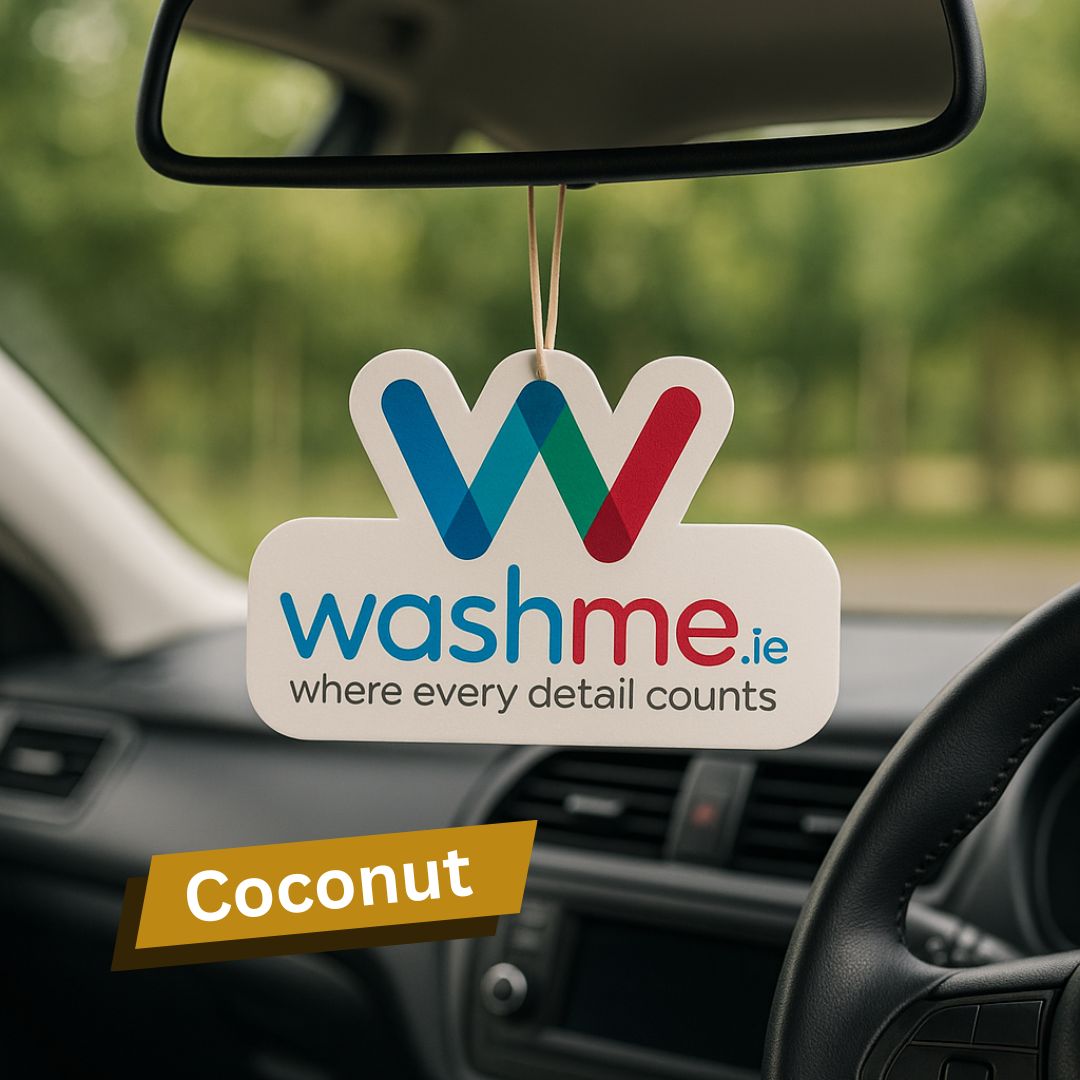 Coconut Car air freshener with 'washme.ie' logo hanging from a car's rearview mirror.