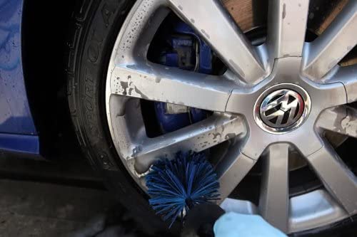 EZ Detailing Big EZ Detail brush blue with black on Volkswagen wheel with blue nitrile gloves and blue brake calipers
